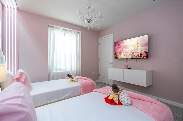 a view of a backyard with plants and a patio