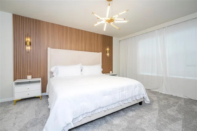 a bedroom with two beds and a couch