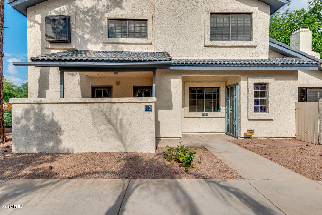 1222 West Baseline Road, Unit 112 Tempe, AZ 85283 - Photo 1 of 26 a front view of a house