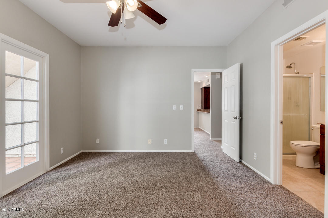 1222 West Baseline Road, Unit 112 Tempe, AZ 85283 - Photo 12 of 26 a view of a room with a ceiling fan and bathroom space