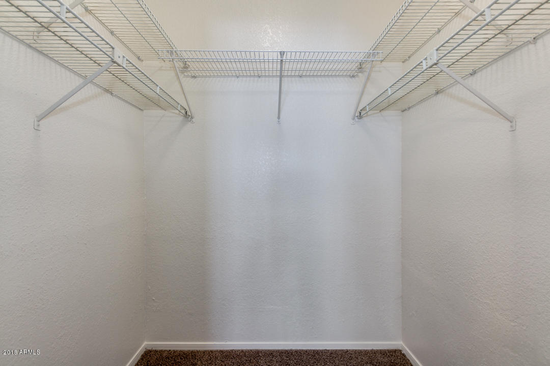 1222 West Baseline Road, Unit 112 Tempe, AZ 85283 - Photo 14 of 26 a view of a room with racks on the wall