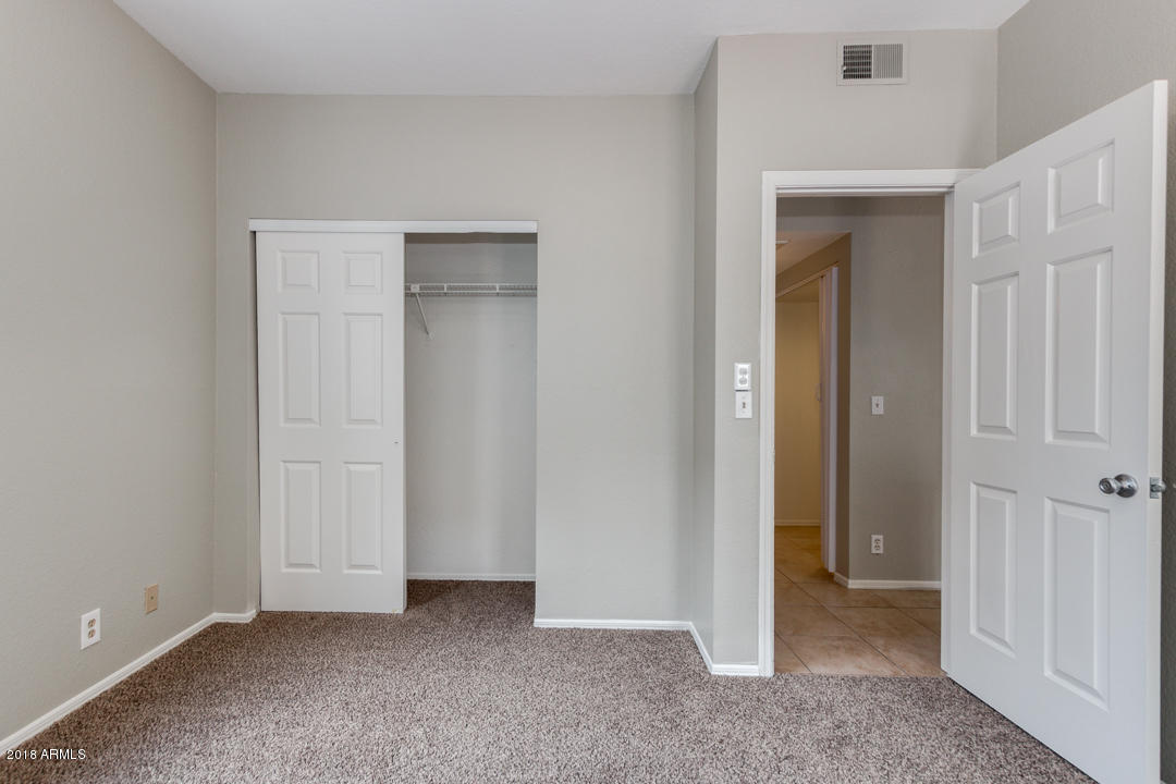 1222 West Baseline Road, Unit 112 Tempe, AZ 85283 - Photo 15 of 26 an empty room with closet area