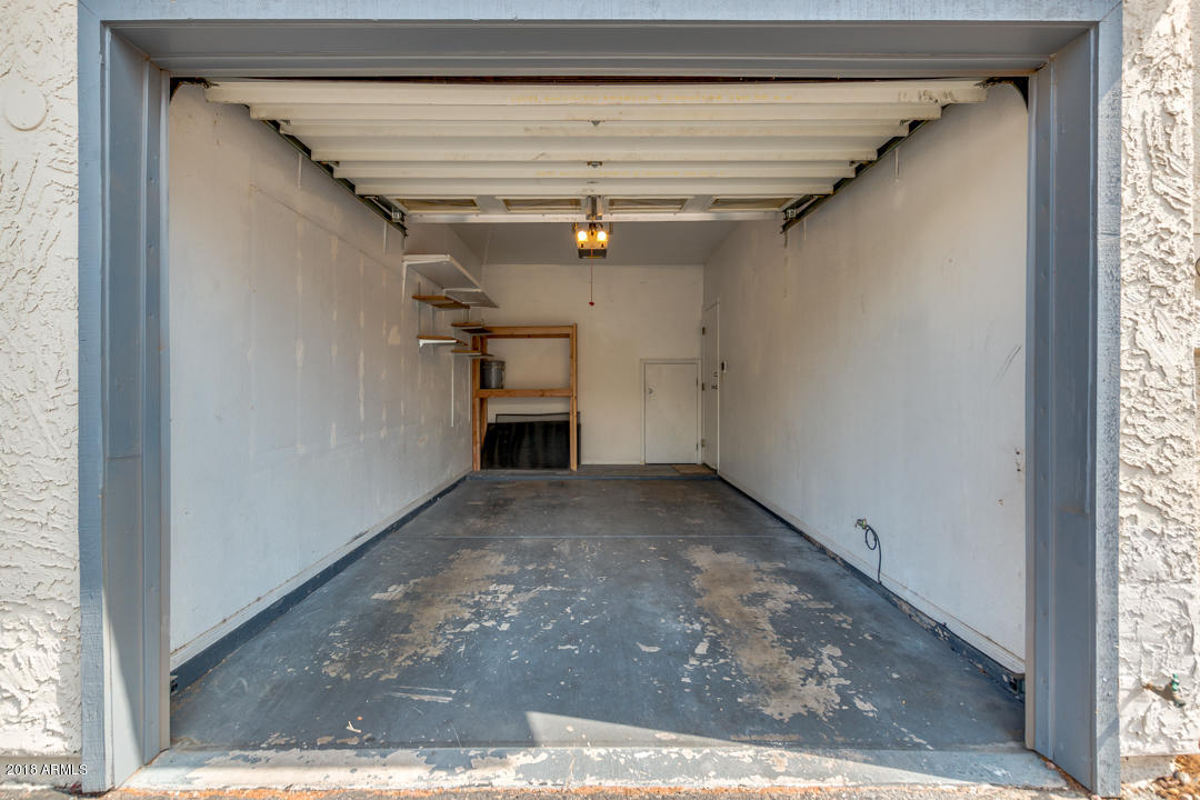 1222 West Baseline Road, Unit 112 Tempe, AZ 85283 - Photo 26 of 26 a view of a hallway with a window