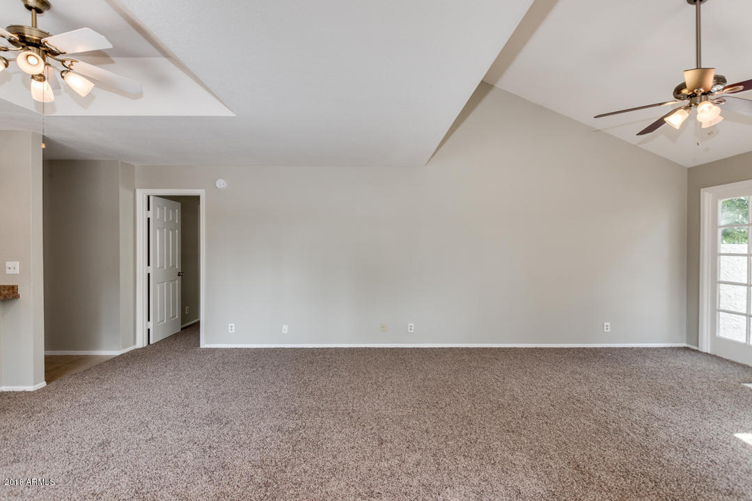1222 West Baseline Road, Unit 112 Tempe, AZ 85283 - Photo 9 of 26 a view of an empty room with a window