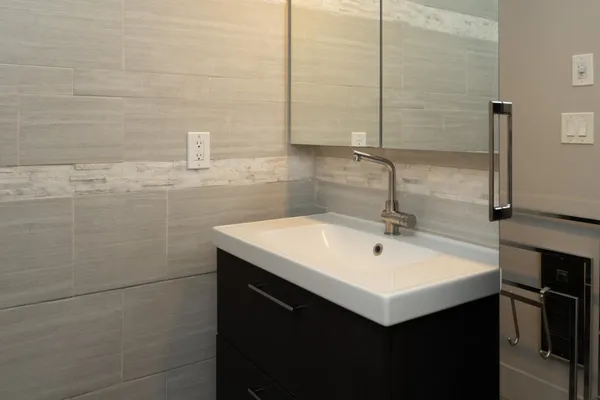 a bathroom with a sink and a mirror