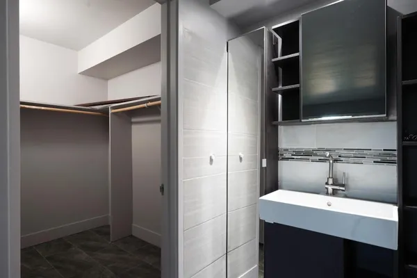 a kitchen with a refrigerator and a sink