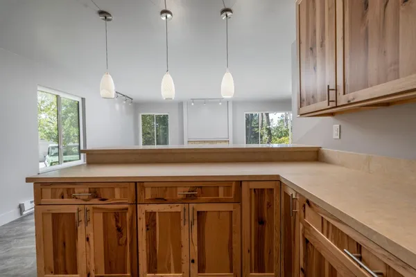 a kitchen with a cabinets a sink and a window