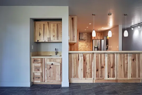 a view of kitchen with wooden floor