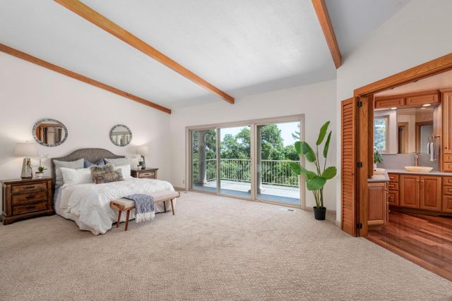 a spacious bathroom with sink and mirror