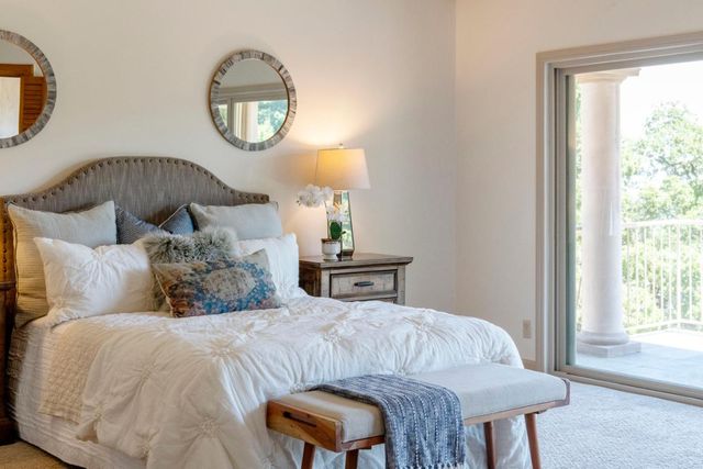 a kitchen with a window a sink and cabinets