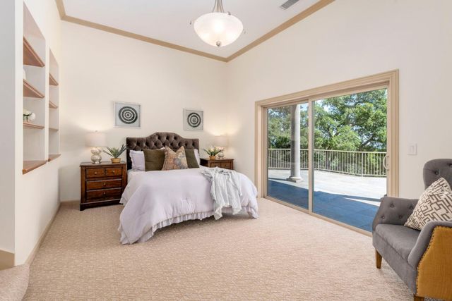 a view of a deck with two chair and a potted plant