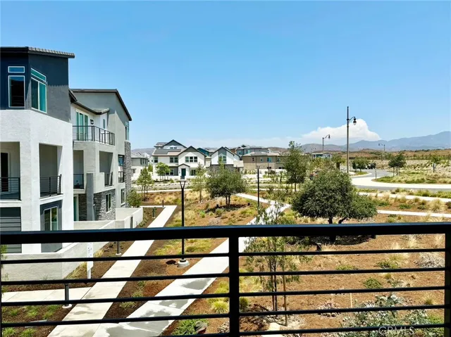 a view of a large building from a balcony