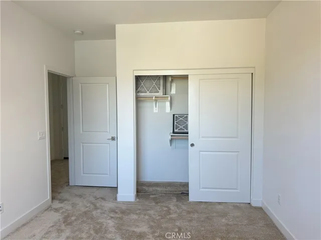 a bathroom with a shower sink vanity mirror and toilet