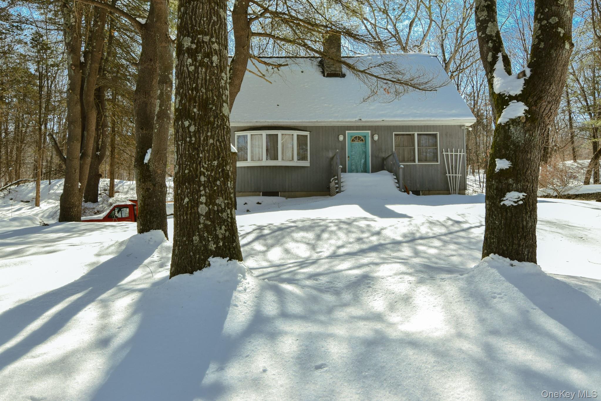 94 Hilltop Road Rhinebeck, NY 12572 - Photo 1 of 28 a view of a house with a yard covered in snow