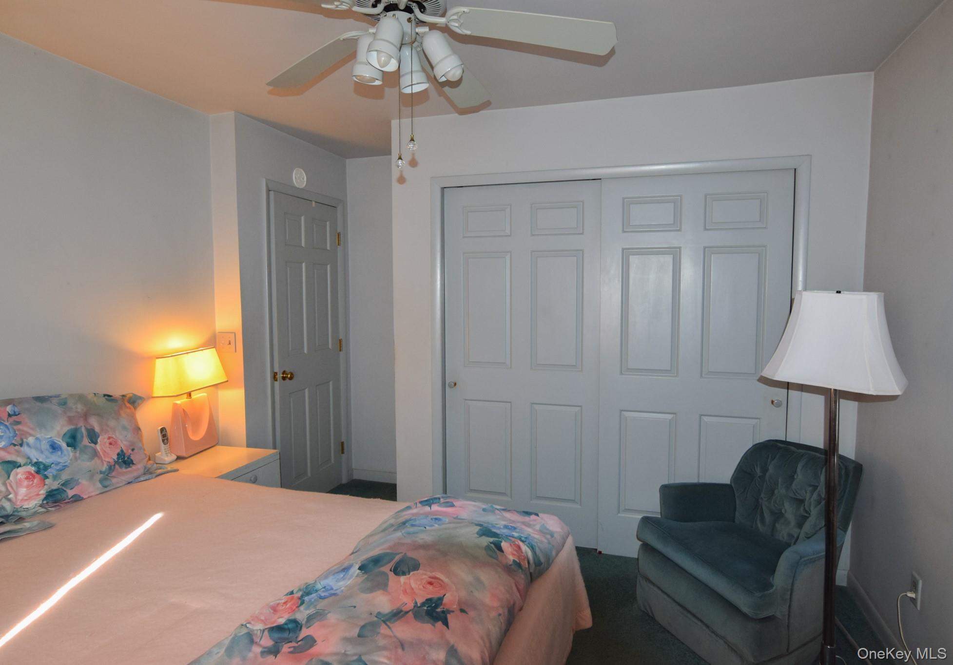 94 Hilltop Road Rhinebeck, NY 12572 - Photo 14 of 28 a bedroom with a bed and a lamp