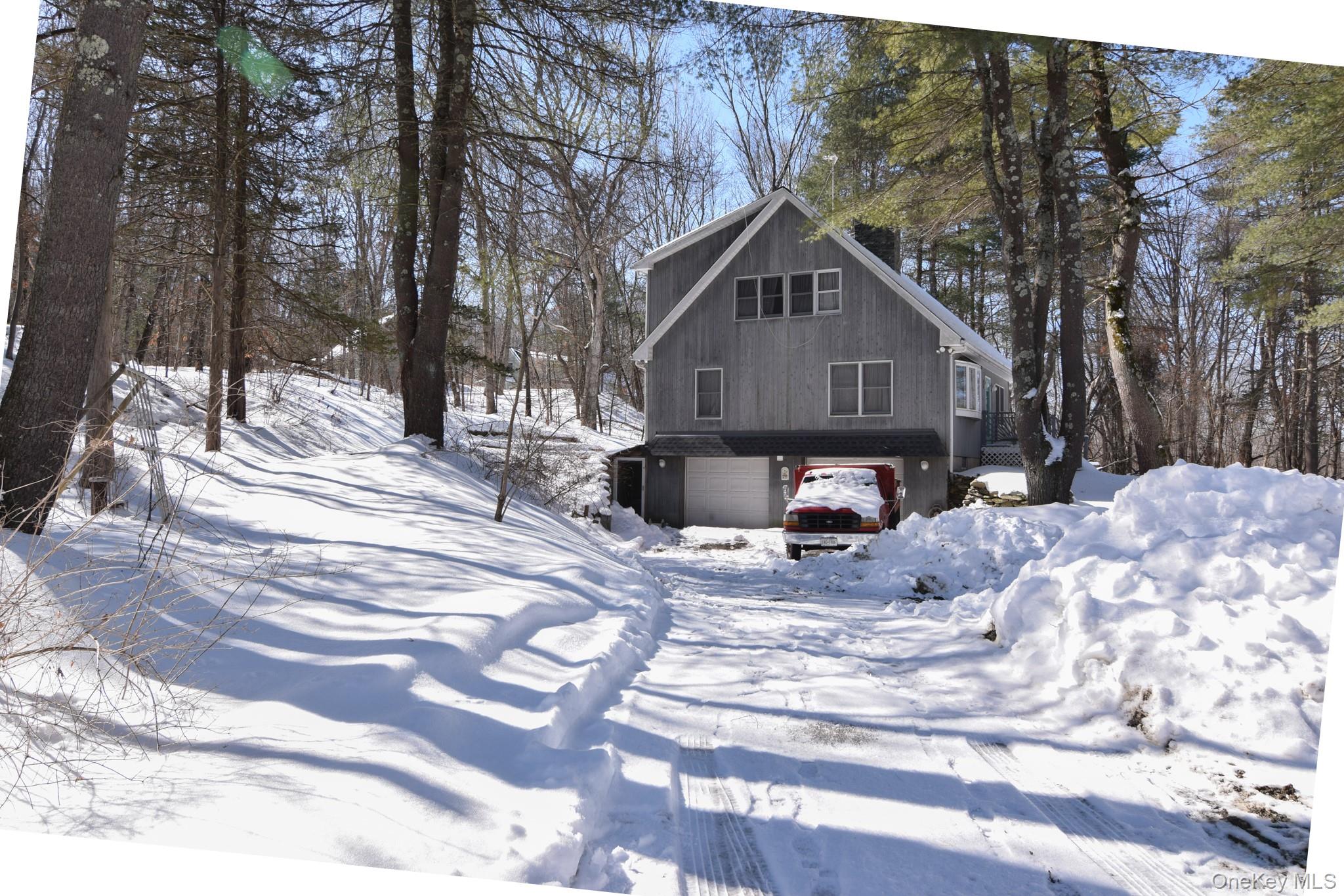 94 Hilltop Road Rhinebeck, NY 12572 - Photo 25 of 28 a view of a house with snow on the road