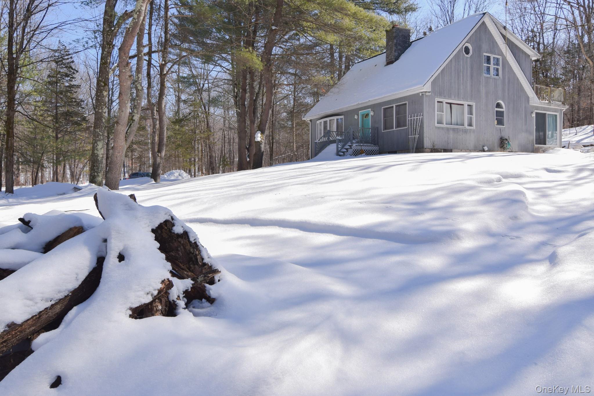 94 Hilltop Road Rhinebeck, NY 12572 - Photo 26 of 28 a view of the house with snow in the background