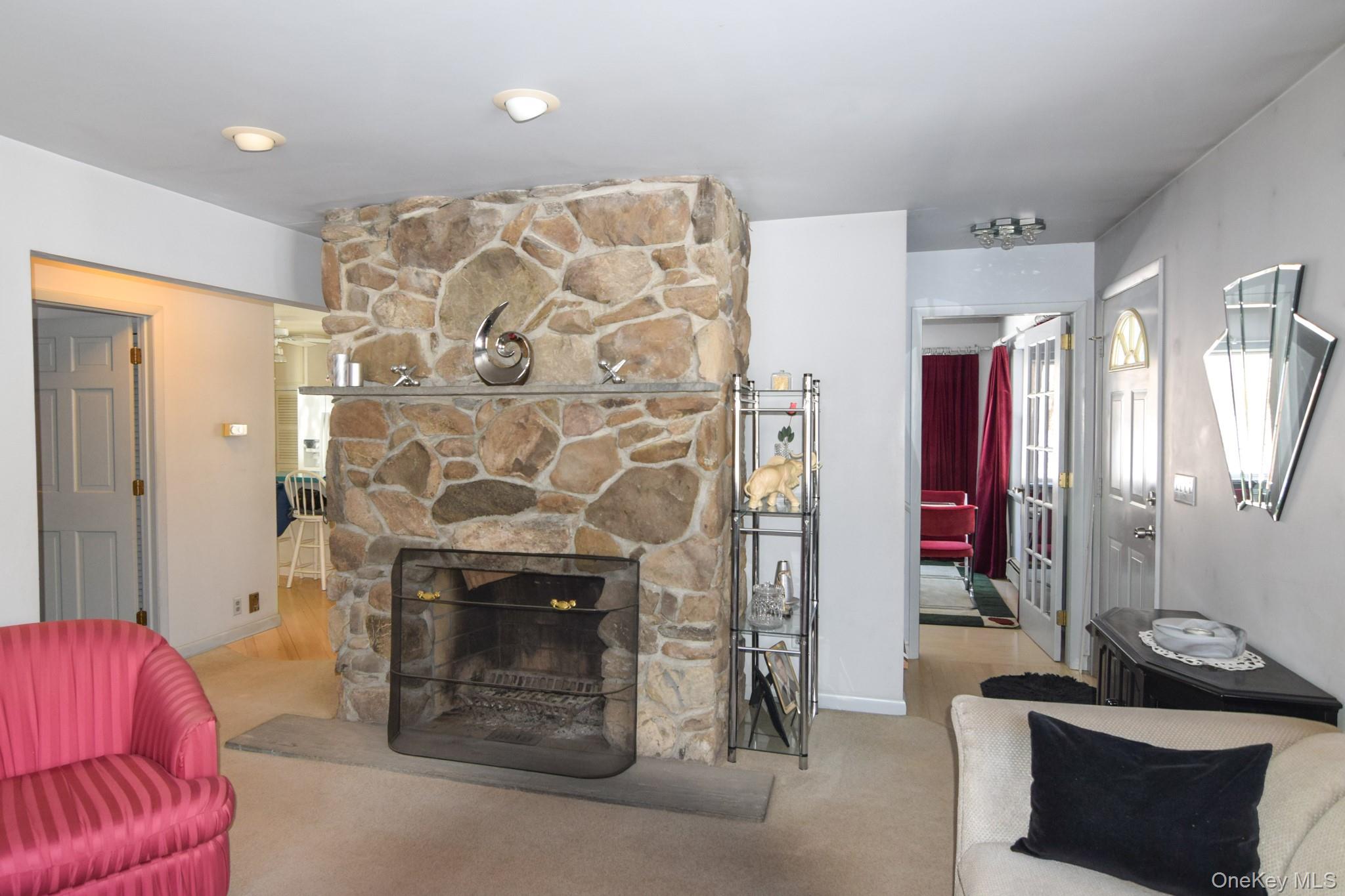94 Hilltop Road Rhinebeck, NY 12572 - Photo 4 of 28 a living room with furniture and a fireplace