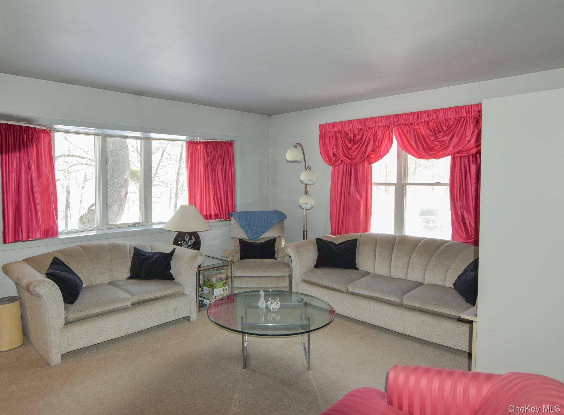 94 Hilltop Road Rhinebeck, NY 12572 - Photo 5 of 28 a living room with furniture and a large window