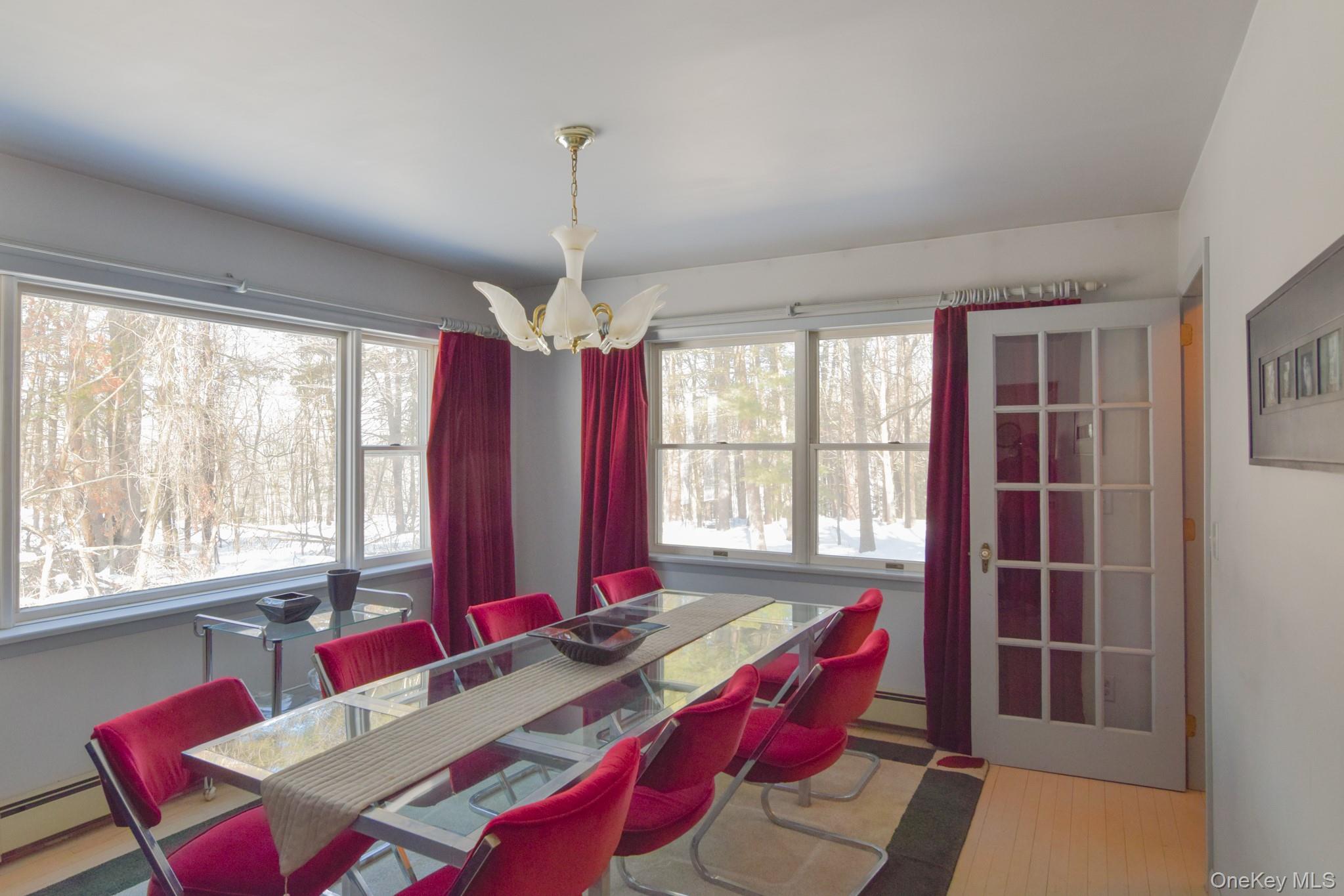 94 Hilltop Road Rhinebeck, NY 12572 - Photo 6 of 28 a view of a dining room with furniture window and outside view