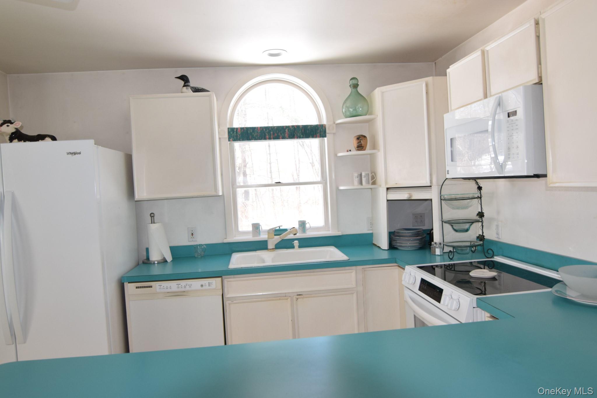 94 Hilltop Road Rhinebeck, NY 12572 - Photo 10 of 28 a kitchen with granite countertop a sink cabinets and window