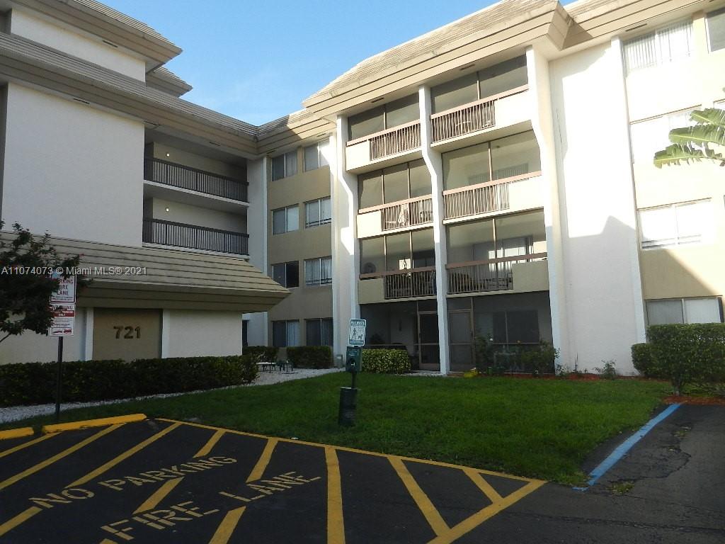 721 North Pine Island Road, Unit 112 Plantation, FL 33324 - Photo 1 of 27 a front view of a house with a yard
