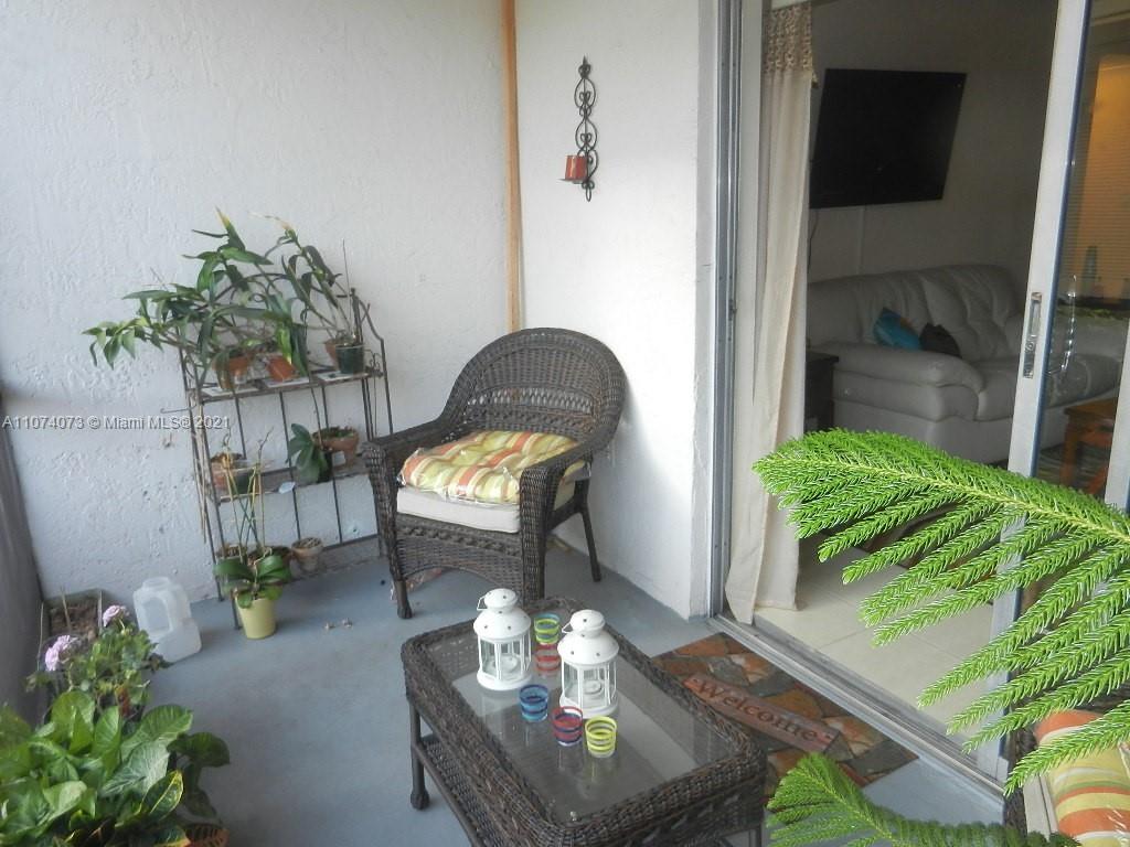 721 North Pine Island Road, Unit 112 Plantation, FL 33324 - Photo 15 of 27 a living room with furniture