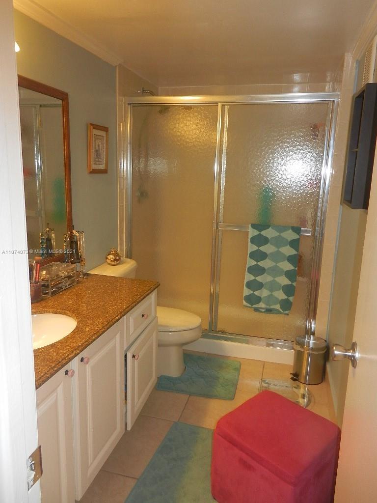 721 North Pine Island Road, Unit 112 Plantation, FL 33324 - Photo 18 of 27 a spacious bathroom with a granite countertop sink and a mirror