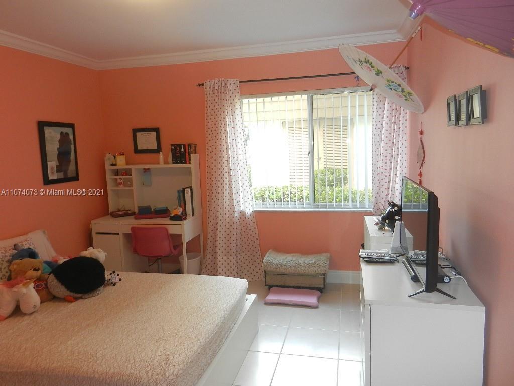 721 North Pine Island Road, Unit 112 Plantation, FL 33324 - Photo 19 of 27 a bedroom with furniture and a window