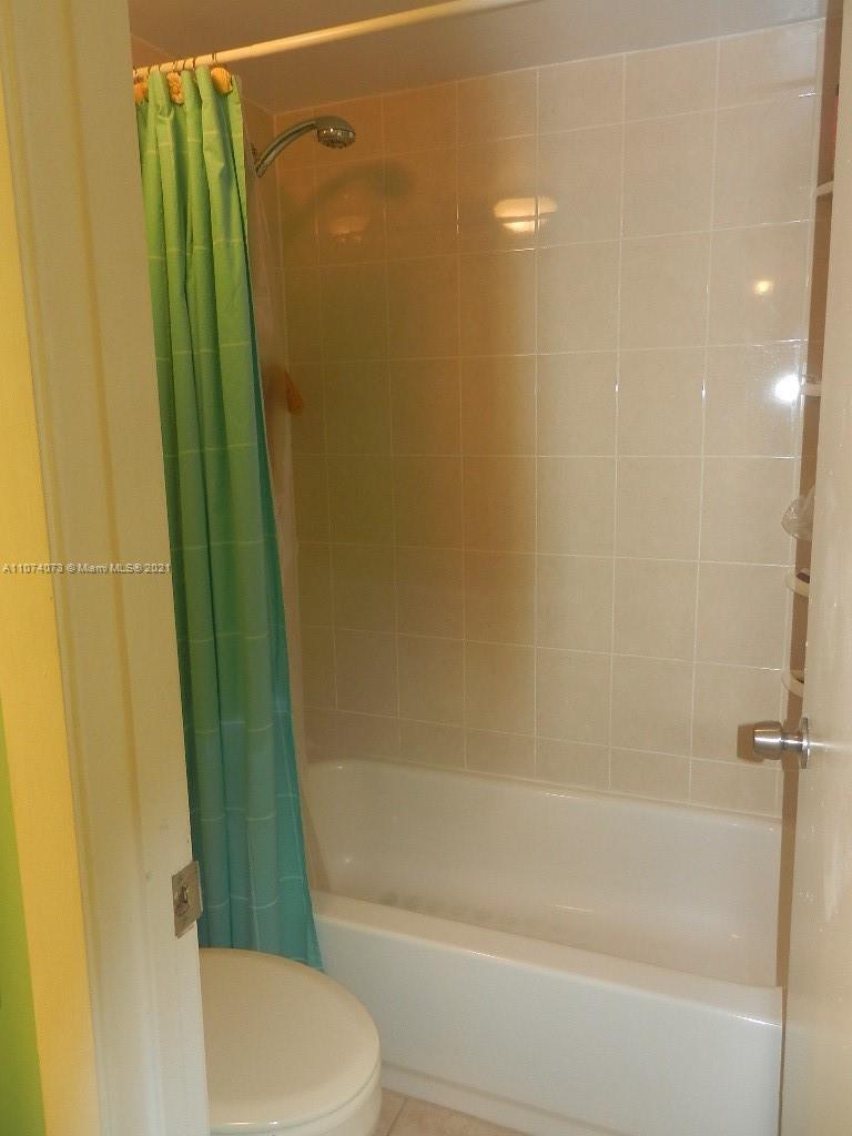 721 North Pine Island Road, Unit 112 Plantation, FL 33324 - Photo 25 of 27 a bathroom with a sink and a mirror