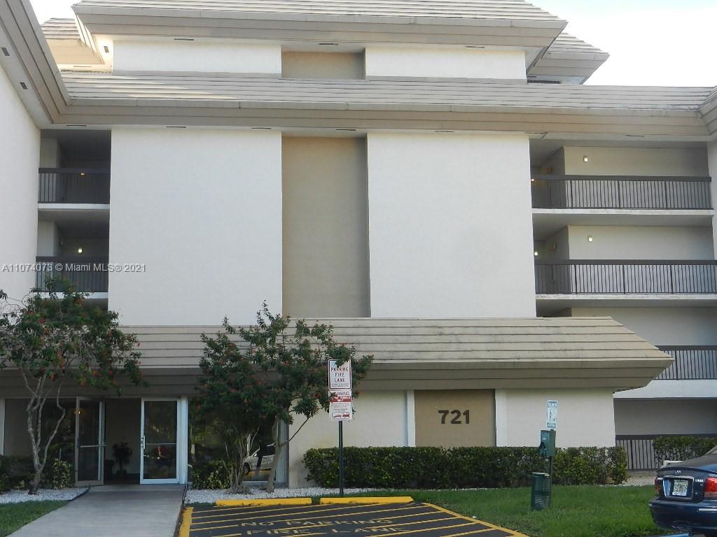 721 North Pine Island Road, Unit 112 Plantation, FL 33324 - Photo 27 of 27 a front view of a house with garden