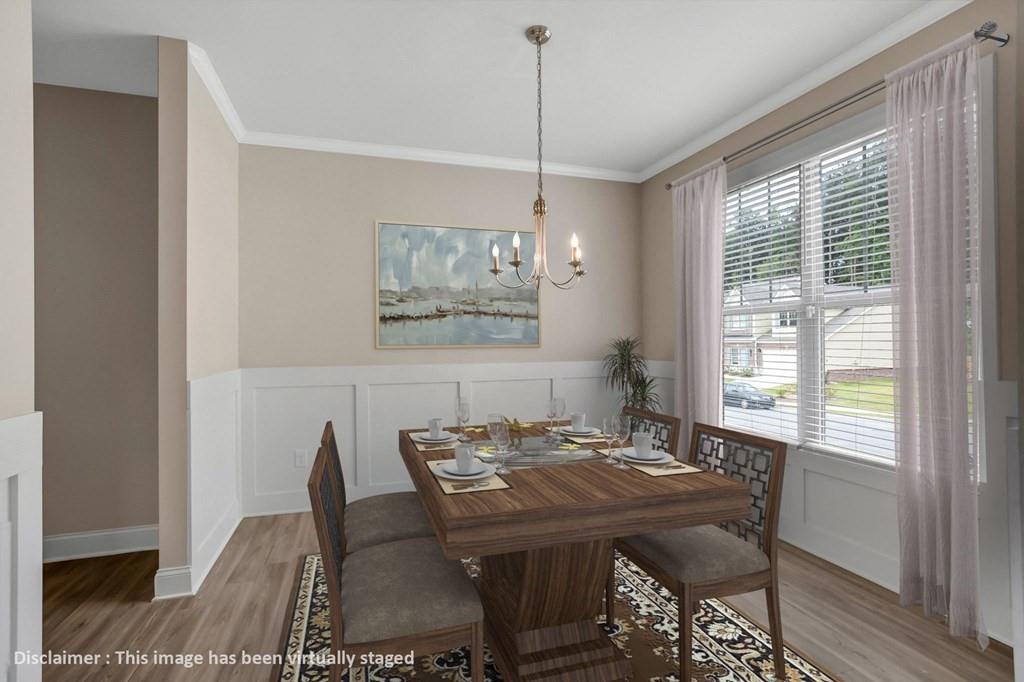 1852 Auburn Road, Unit RIVERBROOK Dacula, GA 30019 - Photo 12 of 31 a view of a dining room with furniture window and wooden floor