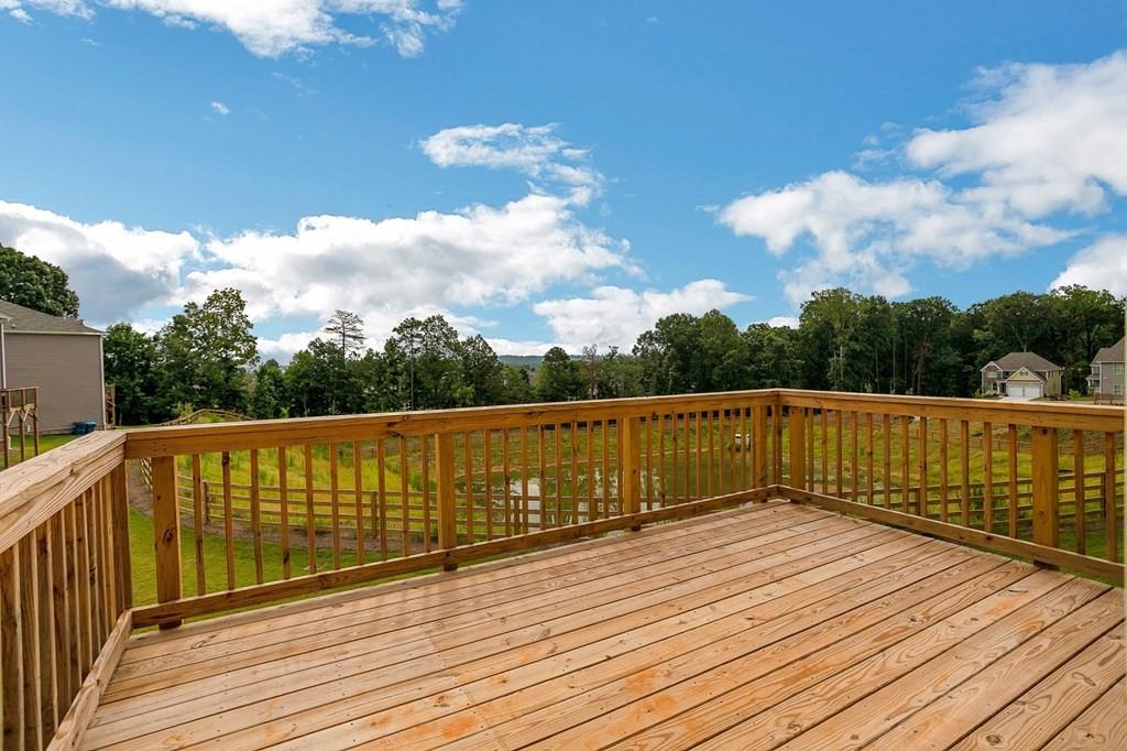 1852 Auburn Road, Unit RIVERBROOK Dacula, GA 30019 - Photo 19 of 31 a balcony with wooden floor