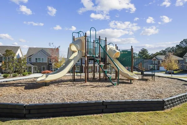 a view of a house with a park
