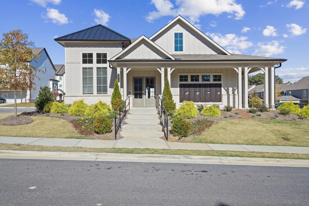 1852 Auburn Road, Unit RIVERBROOK Dacula, GA 30019 - Photo 23 of 31 front view of a house with a porch