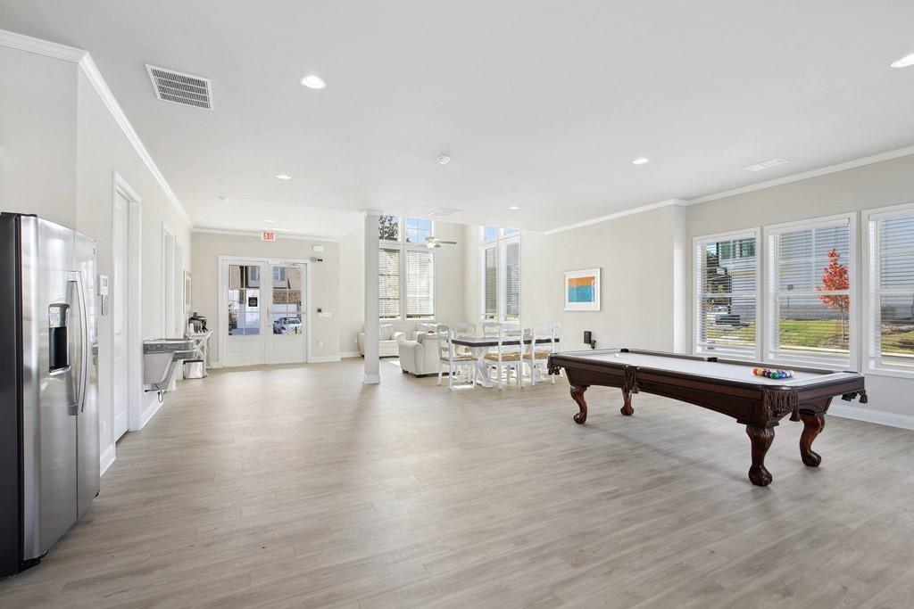 1852 Auburn Road, Unit RIVERBROOK Dacula, GA 30019 - Photo 30 of 31 a living room with furniture pool table and a table