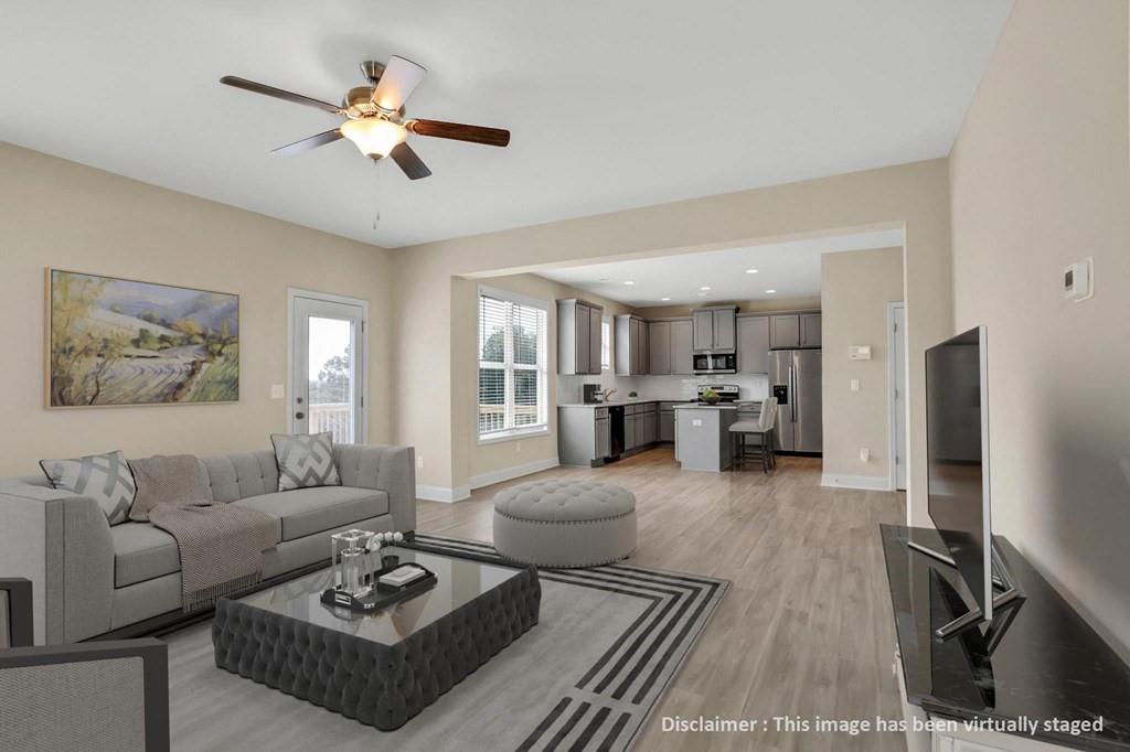 1852 Auburn Road, Unit RIVERBROOK Dacula, GA 30019 - Photo 6 of 31 a living room with furniture kitchen view and a window