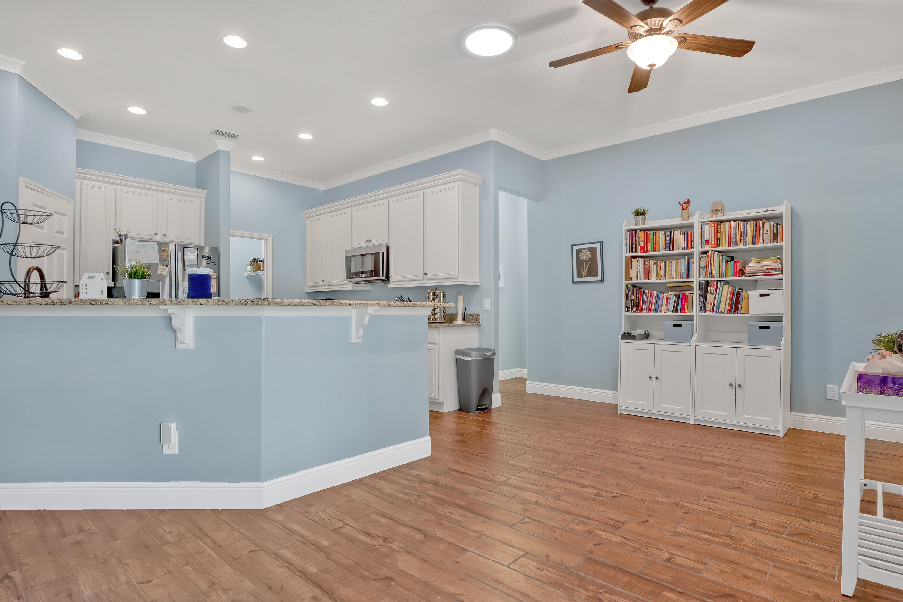 1358 Outrigger Circle Rockledge, FL 32955 - Photo 13 of 48 a view of kitchen with stainless steel appliances cabinets and wooden floor