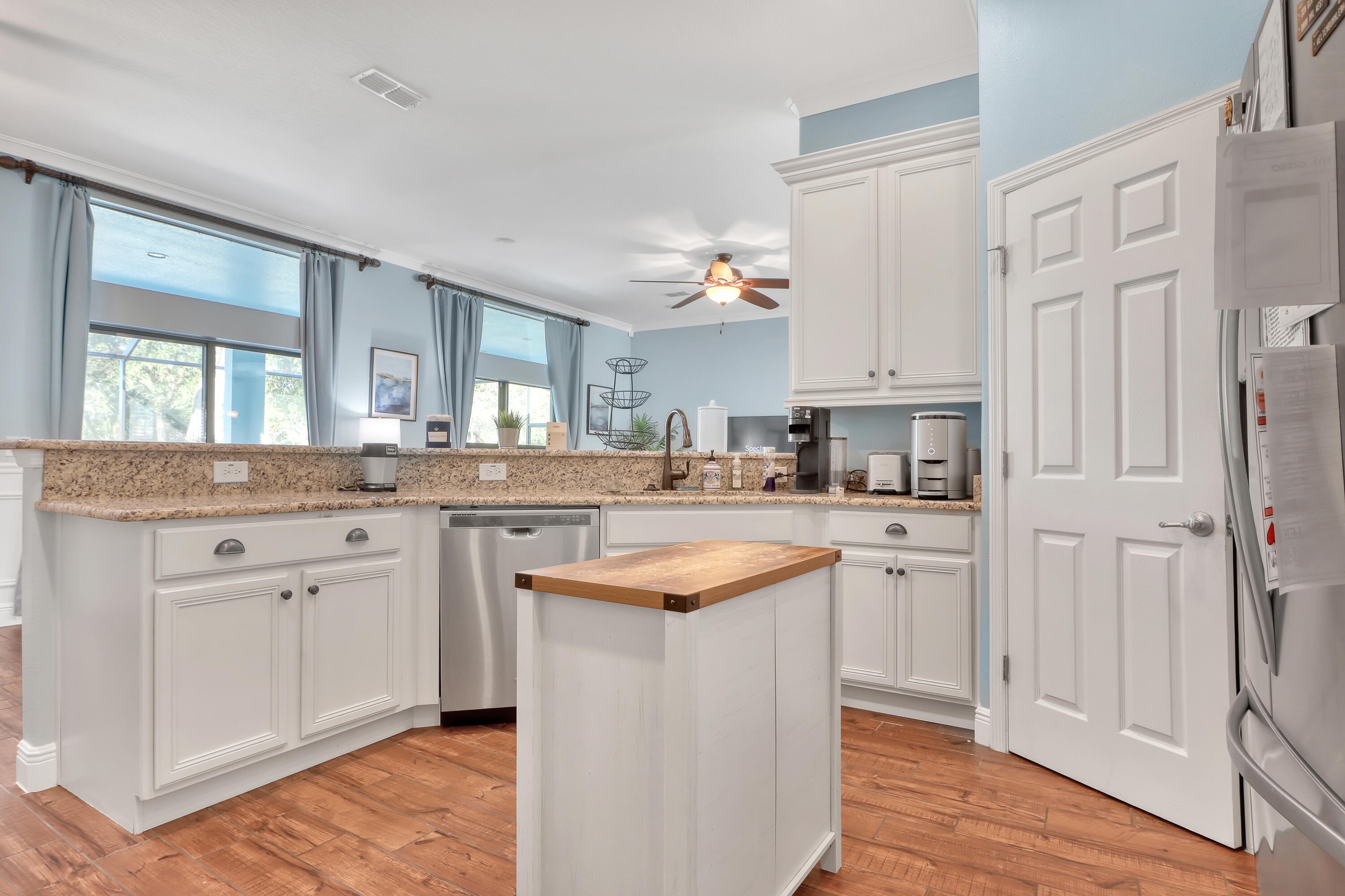1358 Outrigger Circle Rockledge, FL 32955 - Photo 18 of 48 a kitchen with stainless steel appliances granite countertop a sink and cabinets