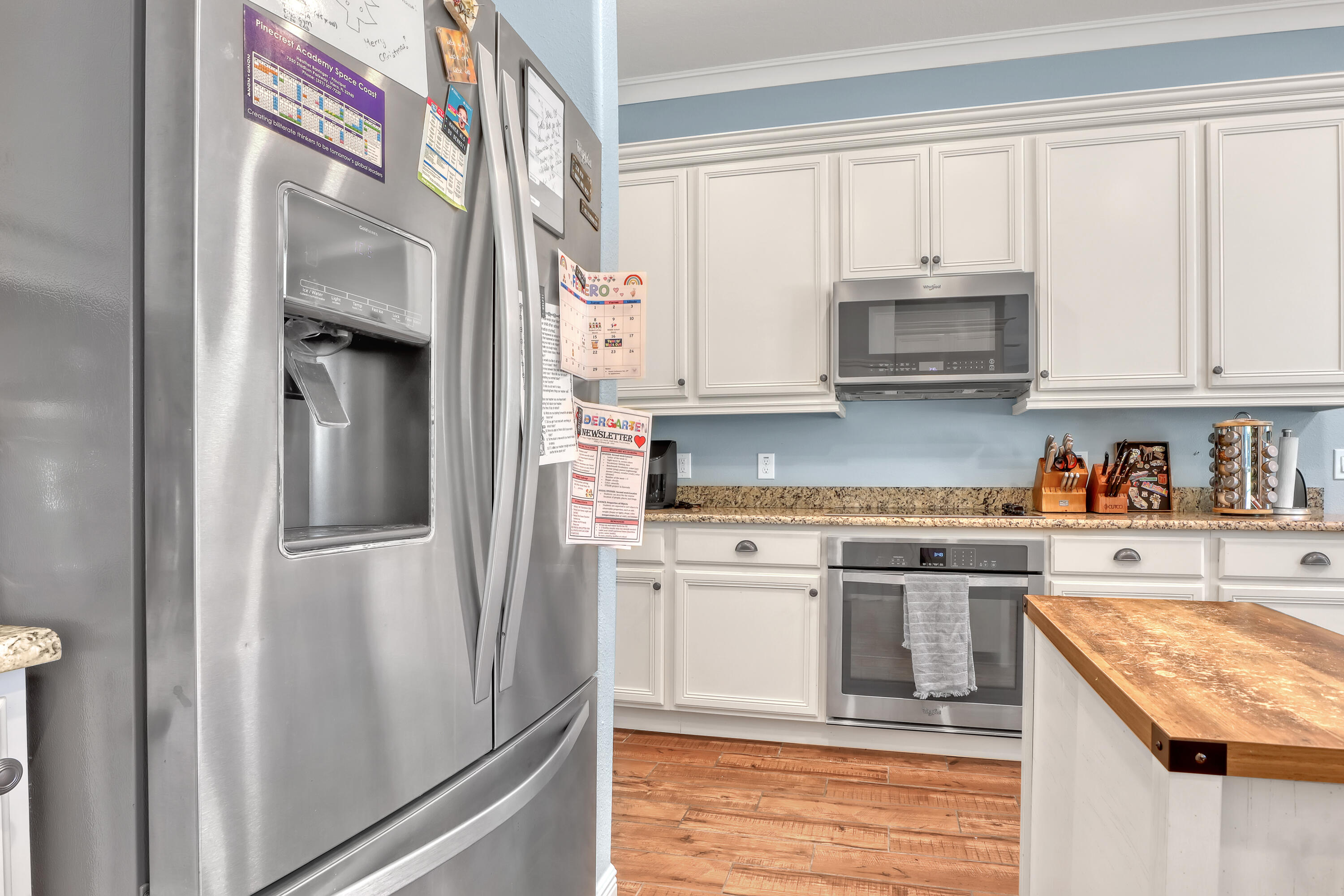 1358 Outrigger Circle Rockledge, FL 32955 - Photo 19 of 48 a kitchen with stainless steel appliances granite countertop a refrigerator a stove and a sink