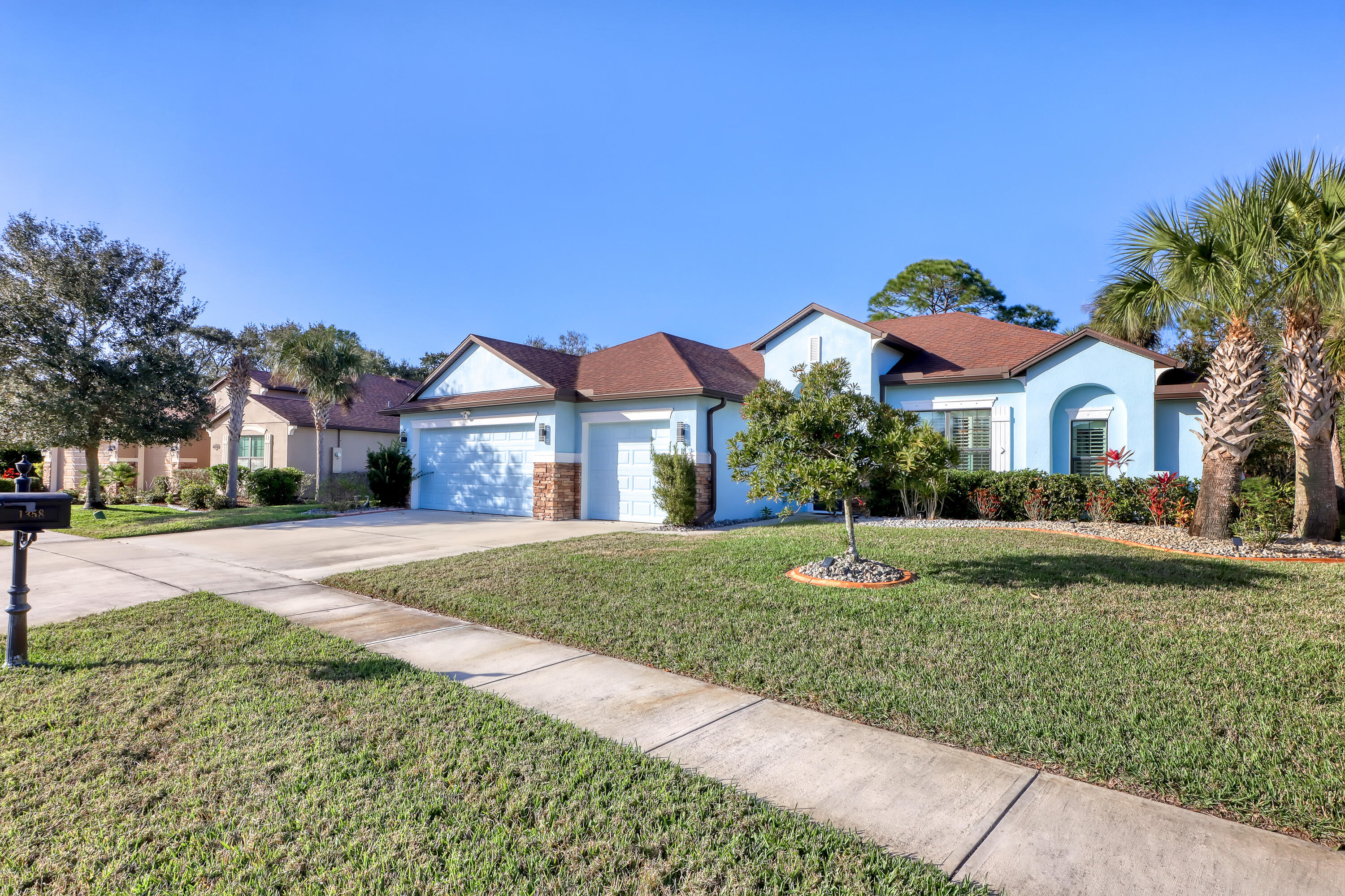 1358 Outrigger Circle Rockledge, FL 32955 - Photo 2 of 48 a front view of a house with a yard