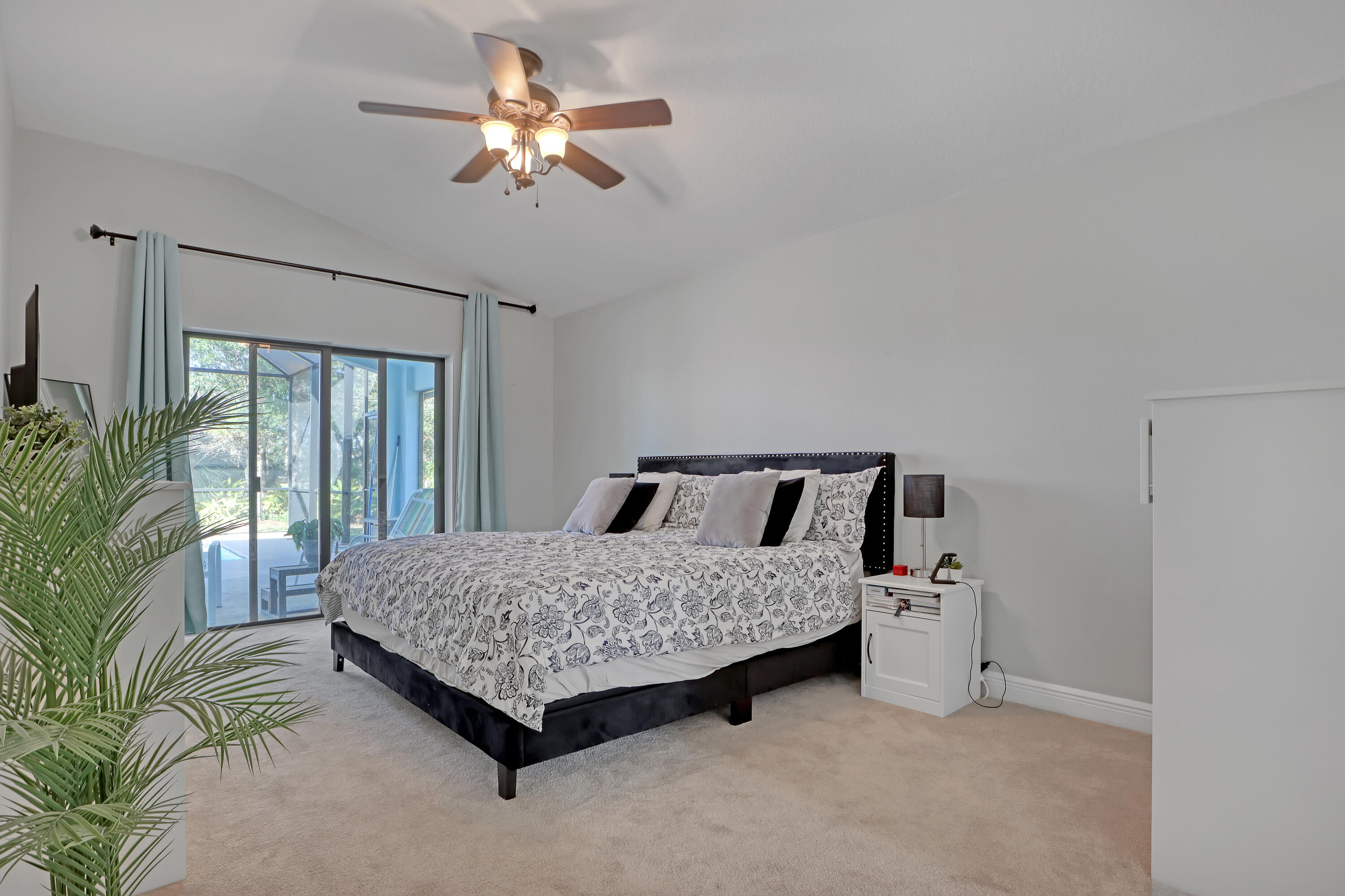 1358 Outrigger Circle Rockledge, FL 32955 - Photo 22 of 48 a room with a bed and a chandelier
