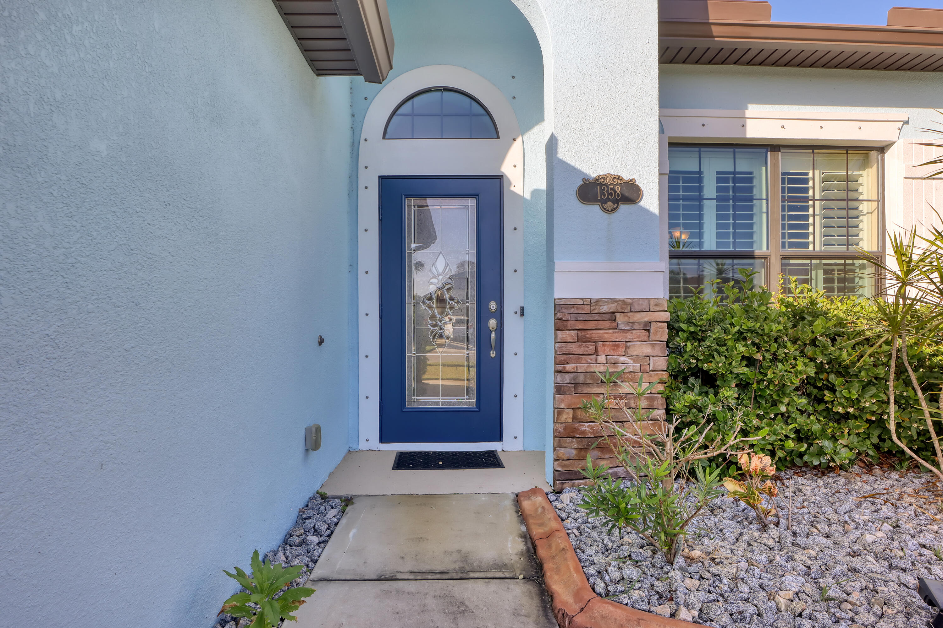 1358 Outrigger Circle Rockledge, FL 32955 - Photo 4 of 48 a view of a brick house with potted plants
