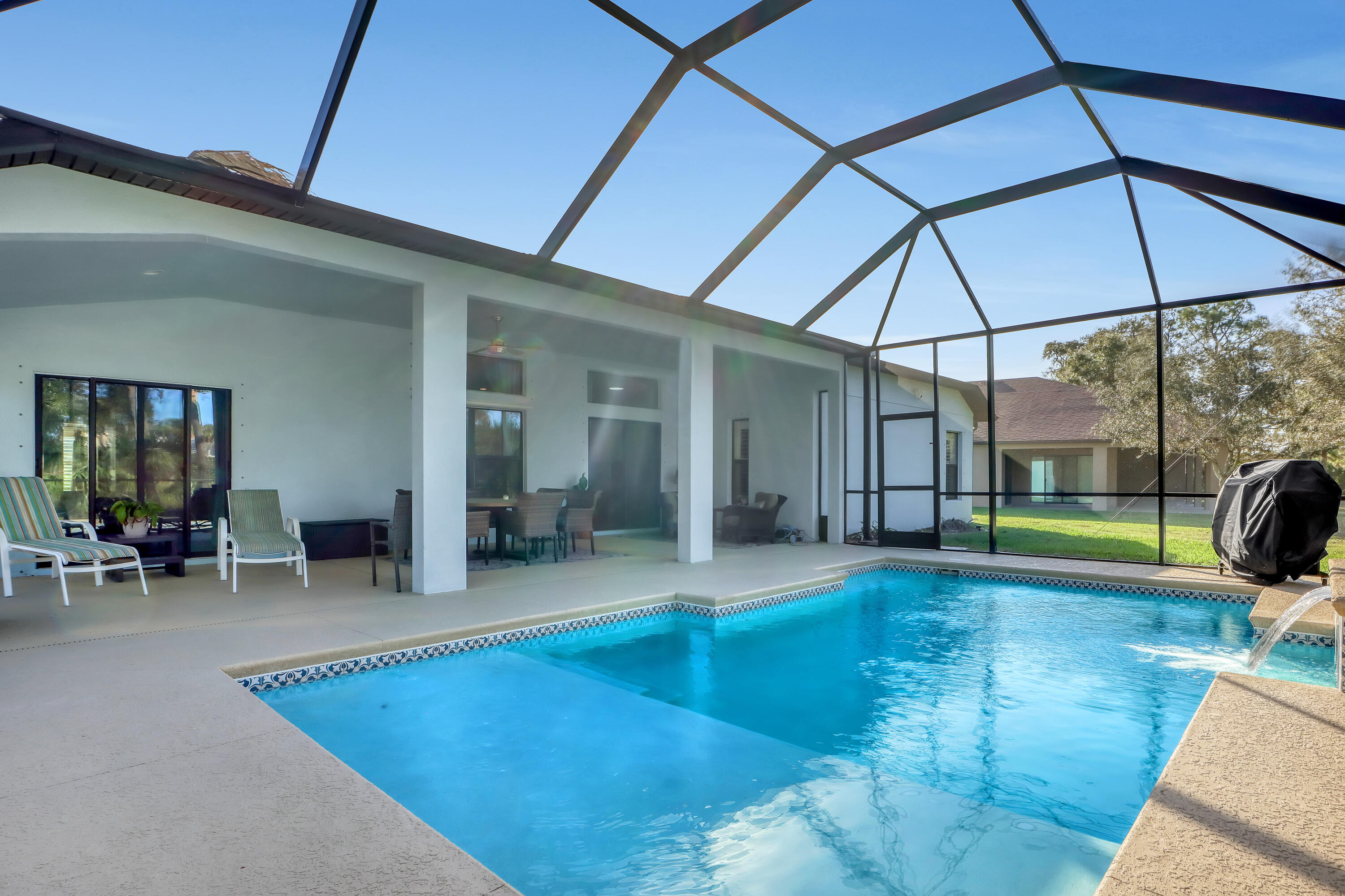 1358 Outrigger Circle Rockledge, FL 32955 - Photo 44 of 48 a view of a patio with swimming pool table and chairs