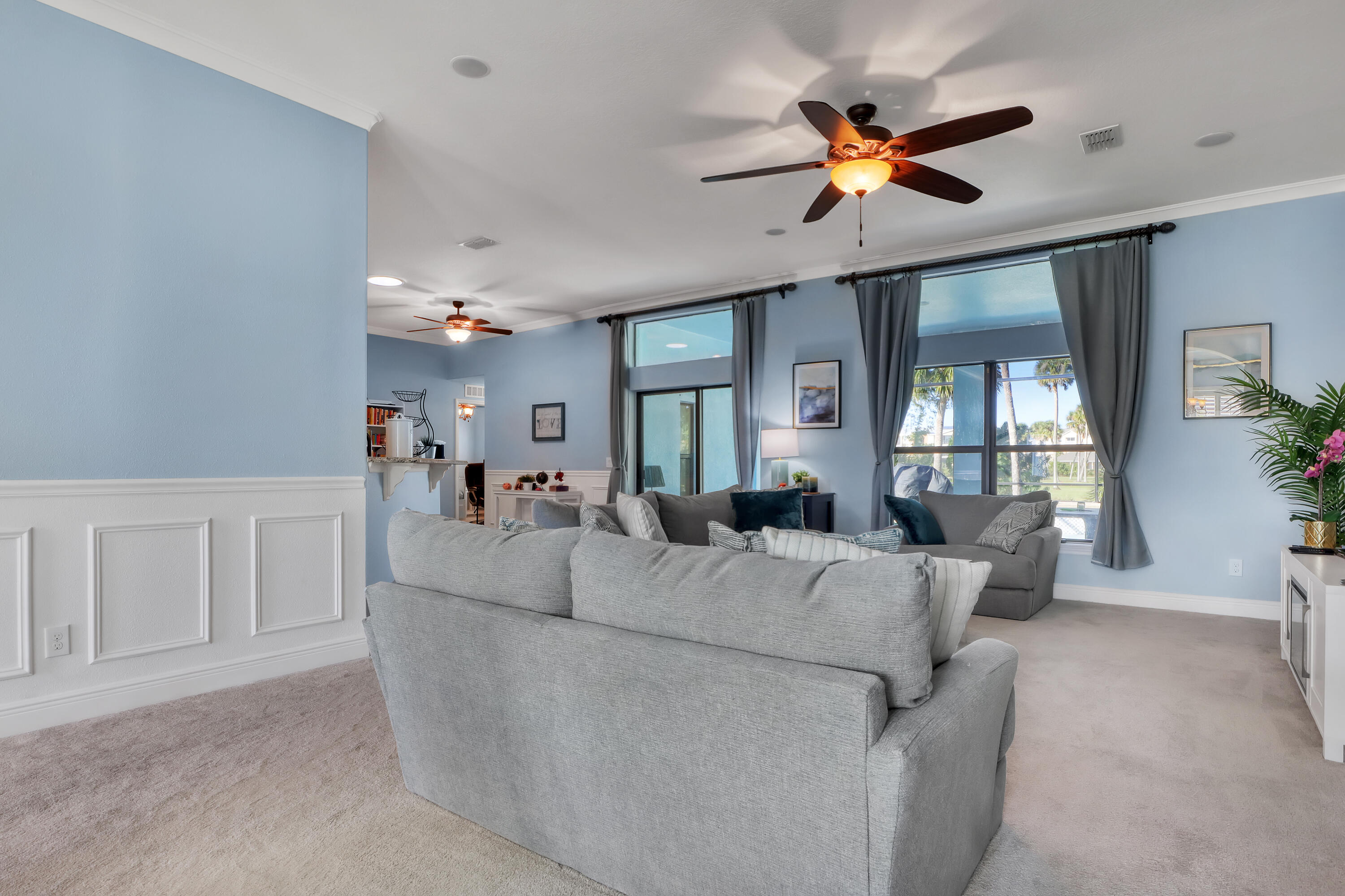 1358 Outrigger Circle Rockledge, FL 32955 - Photo 7 of 48 a living room with furniture and a chandelier