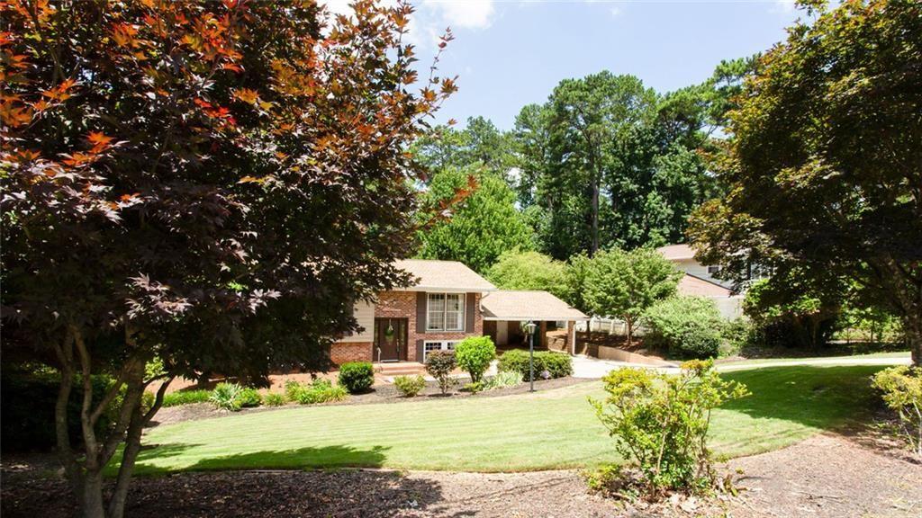 2814 Goodfellows Road Tucker, GA 30084 - Photo 4 of 46 a front view of a house with a yard and porch