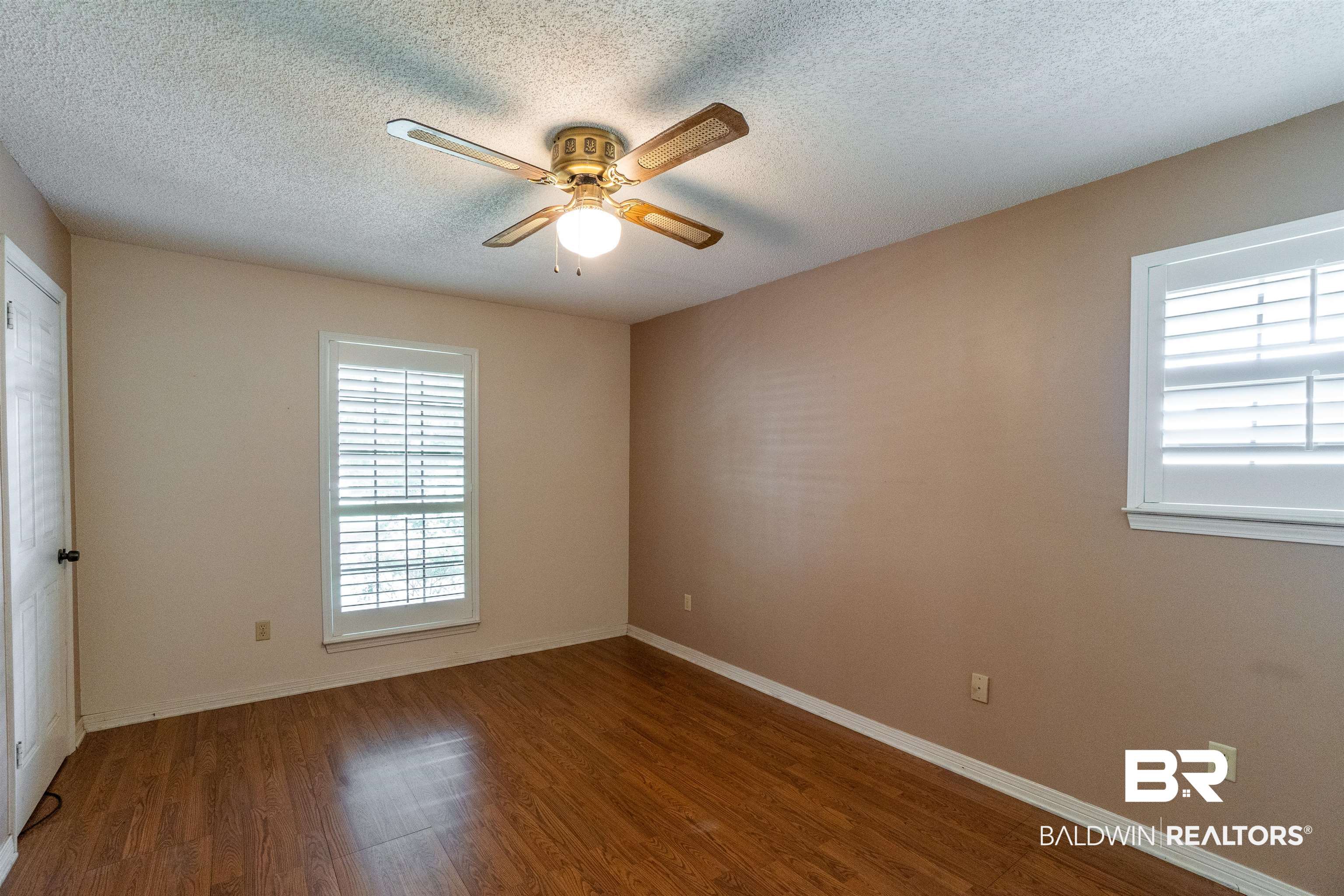 10349 Longview Drive West Foley, AL 36535 - Photo 23 of 35 Empty room with a textured ceiling, ceiling fan, and hardwood / wood-style floors