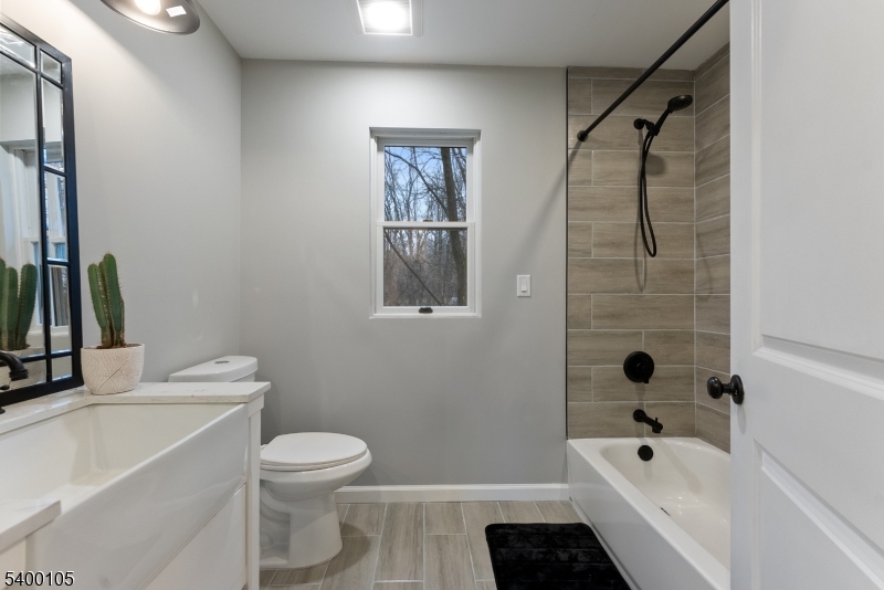 11 Furnace Road Chester, NJ 07930 - Photo 20 of 39 a bathroom with a toilet a sink and bathtub
