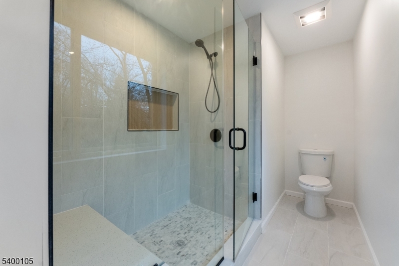 11 Furnace Road Chester, NJ 07930 - Photo 26 of 39 a bathroom with a shower toilet and sink