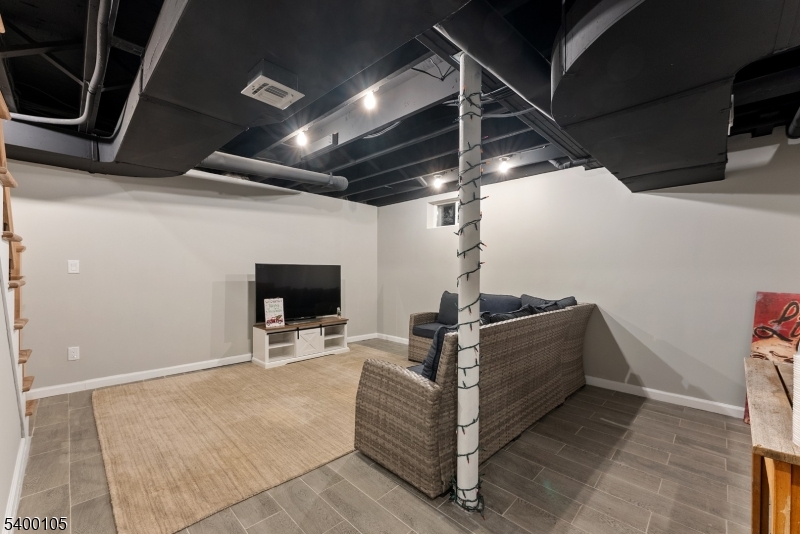 11 Furnace Road Chester, NJ 07930 - Photo 30 of 39 a living room with furniture and a flat screen tv